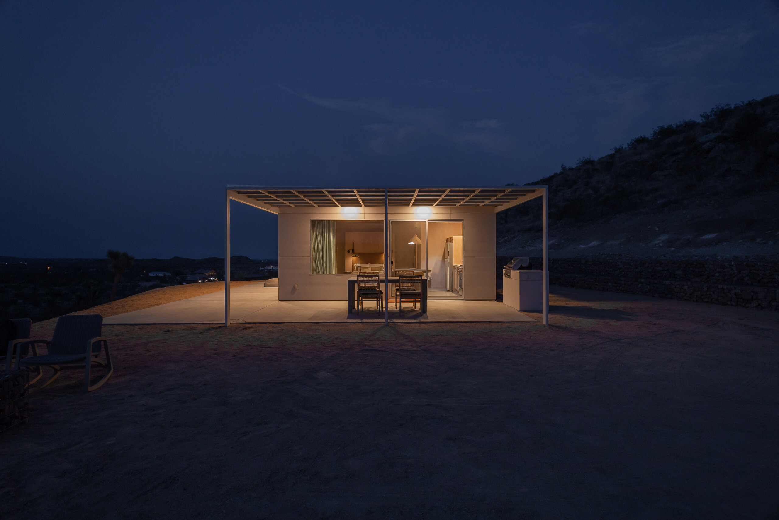 Pause House AM glowing like a lantern at night